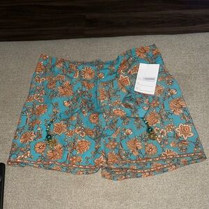 Blue and Orange Bermuda Shorts with Vibrant Floral Design